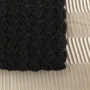 Black clutch knitted pattern